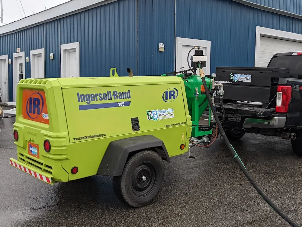 Mobile dustless blasting equipment staged for an onsite job