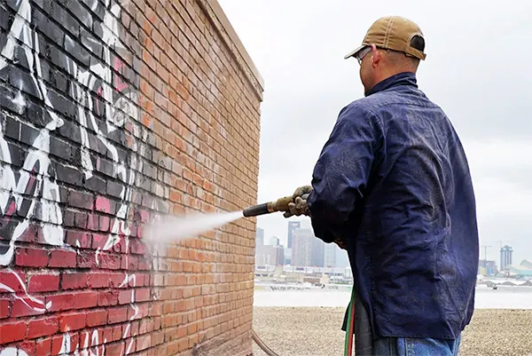 Graffiti removal from a masonry wall